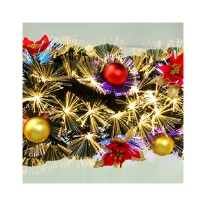Christmas fiber optic garland with red flowers and warm glowing lights for festive decor