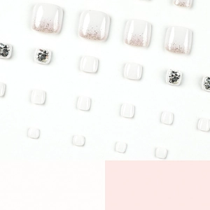 Faux ongles de pieds blancs avec dégradé pailleté et strass pour sandales d'été