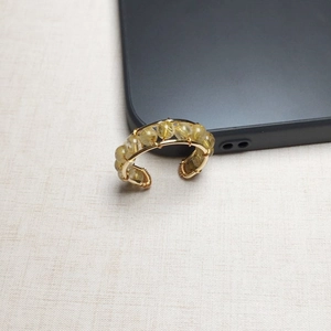 Detail of 14K gold filled wire wrapped ring with faceted yellow-green crystal beads