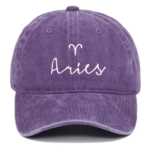 Detail shot of Aries zodiac embroidery on vintage washed purple cotton baseball cap
