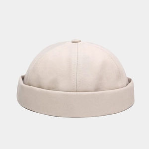 Detail of beige cotton miki hat showing twill fabric texture and minimalist brimless design