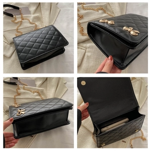 Detailed views of black quilted crossbody bag with gold chain and bow accents