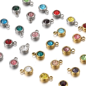 Macro detail of multicolored stainless steel birthstone pendants for DIY jewelry making