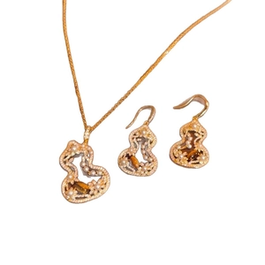 Tiger eye and pearl jewelry set with necklace and earrings in hollow gourd design