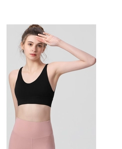 Detail of black U-neck sports bra with wide straps and high elasticity for yoga