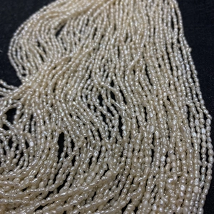 Macro shot of 2-3mm natural freshwater rice pearls for DIY jewelry making and necklaces