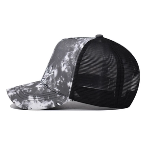 Fashionable trucker hat featuring black and white tie-dye patterns and breathable mesh back