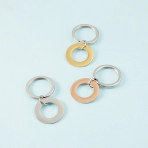 Polished stainless steel round keychains in silver, gold, and rose gold finishes