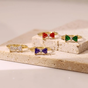 Chic gold-plated bow rings with colorful gemstone inlays in white, purple, red, and green