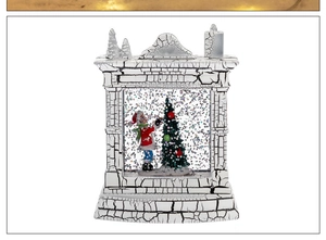 Detail of a decorative Christmas fireplace snow globe lantern with white crackle finish
