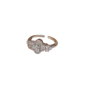 Silver adjustable diamond ring featuring a green shell rhombus flower and cubic zirconia