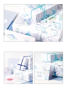Detailed set of colorful ocean themed gift wrapping paper with matching fish tags