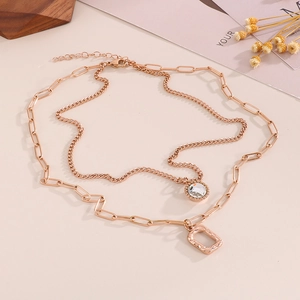 Double-layered rose gold necklace with square pendant and sparkling rhinestone charm
