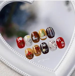Detail of short round cartoon press-on nails featuring hand-painted bears and trees