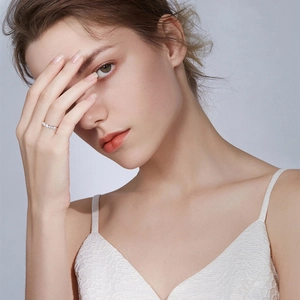 Elegant S925 sterling silver moissanite eternity ring worn by a model on index finger