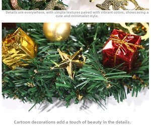 Detail of Christmas wreath featuring golden star, mini gift boxes and pine needles