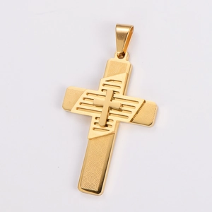 Close-up of golden double-layer cross pendant with geometric texture and hollow pattern