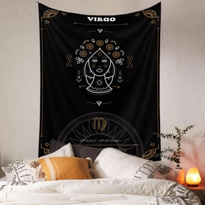 Detailed view of Virgo zodiac tapestry with gold embroidery over a bed in a cozy room