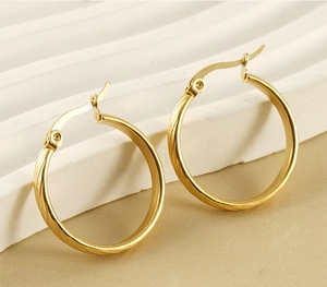Macro view of vintage 18K gold plated stainless steel geometric hoop earrings for women