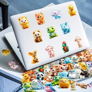 Close-up of 3D cute cartoon animal stickers applied on a white laptop lid and desk