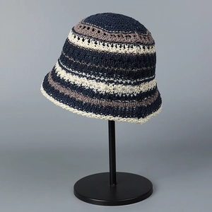 Close-up of tight crochet texture and multi-color striped pattern on knit bucket hat