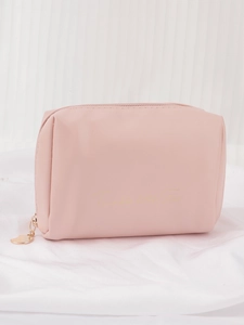Detailed shot of pink PU leather makeup bag with gold Twinkle Little Star text and heart charm