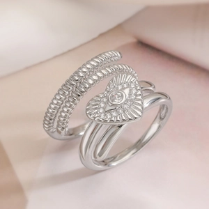Silver layered ring featuring heart-shaped evil eye motif with sparkling zircon stones