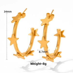 Detailed view of gold stainless steel C-shaped hoop earrings with 3D star charms