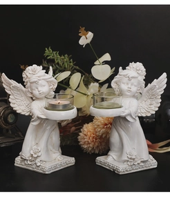 Detailed relief flowers on white resin angel candle holders with glass tea light cups