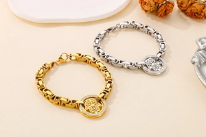 Detail of Hamsa hand charm bracelets with pavé crystals on thick Byzantine chains