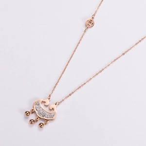 Rose gold Ruyee lock necklace with rhinestones and coin details on a stainless steel chain