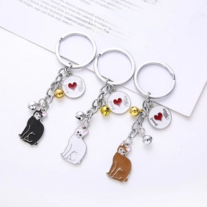 Three metal cat keychains in black white and brown colors with I love cat charms and bells
