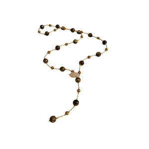 Tiger eye beaded necklace with a gold zircon leaf pendant on a clean white background