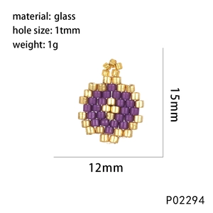 Detail view of purple and gold beaded glass moon pendant with size and weight specs
