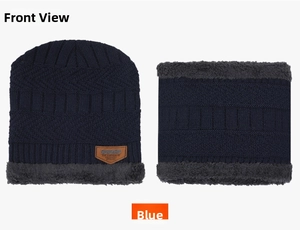 Detailed view of the navy blue winter hat set with thick grey faux fur lining and neck warmer