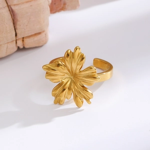 Detail of gold floral ring featuring realistic five-petal flower with textured petals