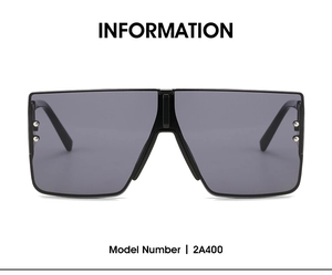 Close-up of oversized square sunglasses featuring silver rivets and model number 2A400