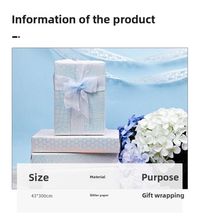 Detail of light blue glitter gift wrap with honeycomb texture and 43x300cm size specs