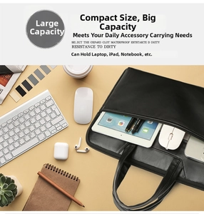 Detailed top-down view of a spacious black laptop bag with organized office accessories