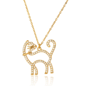 Close-up of golden cat pendant with sparkling zircons and fine cross chain necklace