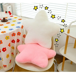 Plush star-shaped decorative pillows in soft pink and white colors for home decor