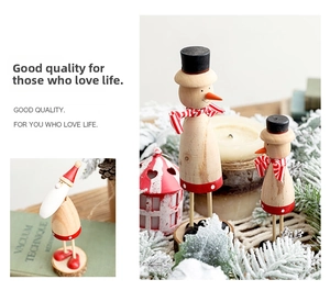 Macro detail of hand-painted wooden Christmas snowman and Santa Claus ornaments