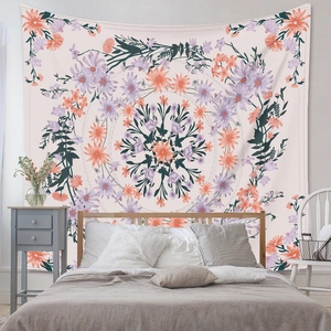 Detailed view of bohemian mandala floral tapestry hanging above a bedroom headboard