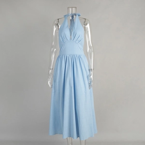 Detail of light blue V-neck halter dress featuring pleated bust and cotton texture