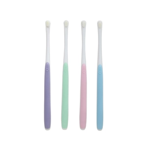 Set of four colorful soft-bristled pet toothbrushes with cute embossed cat paw handles