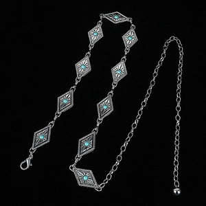 Detail of silver chain belt with turquoise diamond shapes and lobster clasp closure