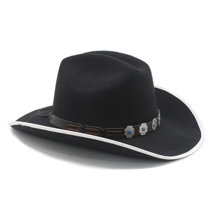 Detailed close-up of a black western cowboy hat with ethnic leather band and blue beads