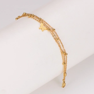 Layered gold stainless steel bracelet featuring butterfly charms and round bead chains