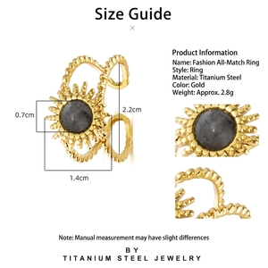 Golden titanium steel open ring with a sun motif and grey natural stone center