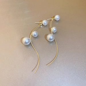 Elegant gold tone long tassel earrings with faux pearls and minimalist curved geometric lines